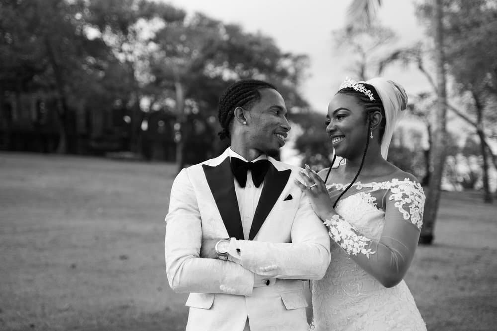 Emotional moment of a couple with the father at a wedding